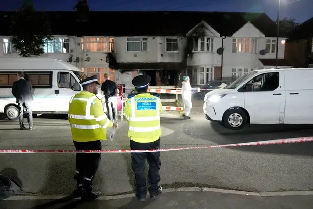 Murder probe launched after woman dies and eight injured in London house fire