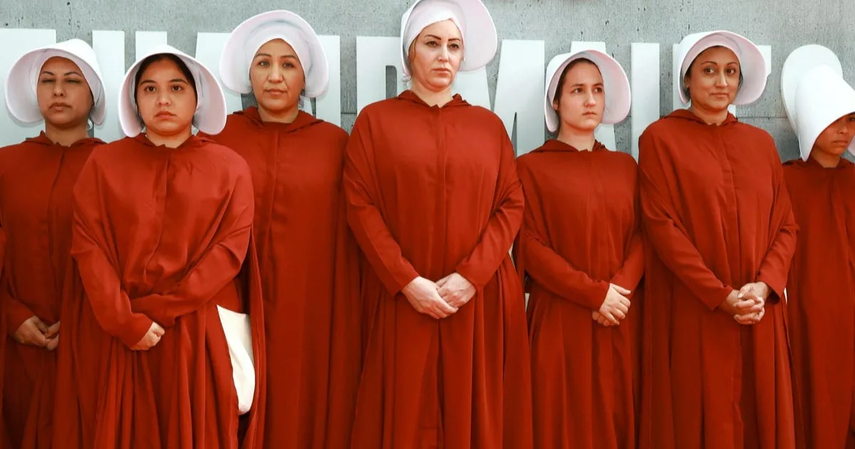 What inspired the outfits in Margaret Atwood's "The Handmaid's Tale"