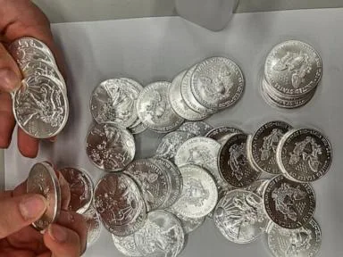 A tip about a swerving van leads police to 66,000 US silver coins in a fraud case